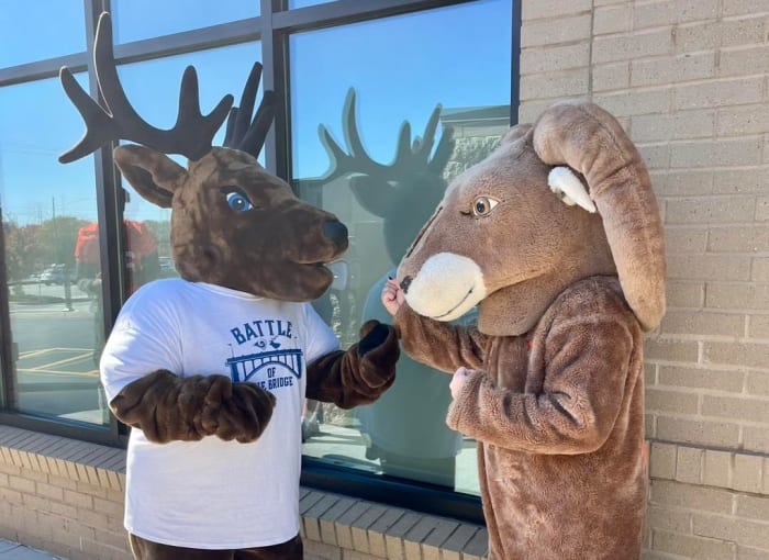 The Battle of the Bridge pits Elkin’s Buckin’ Elk mascot against the Starmount Ram.